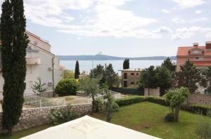 a garden with a view of the water at Apartments by the sea Selce, Crikvenica - 2356 in Selce
