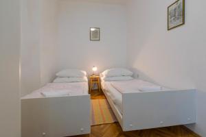 Posteľ alebo postele v izbe v ubytovaní Apartments with parking spaces Selce, Crikvenica - 2381