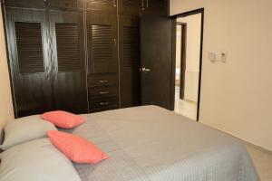 A bed or beds in a room at Casa vacacional para disfrutar en familia