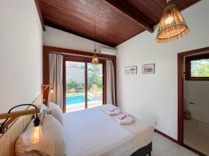 Postel nebo postele na pokoji v ubytování Casa Janela da Lua + 17 fotografií