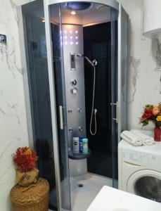 a shower with a glass door in a bathroom at Palace Luxury Apartments The Heart of Belgrade in Belgrade +38 photos