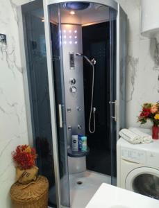 a shower with a glass door in a bathroom at Palace Luxury Apartments The Heart of Belgrade in Belgrade