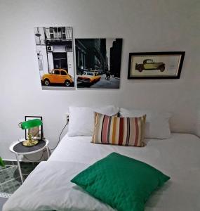 a bedroom with a bed and a yellow car on the wall at Sweet Home in Valjevo