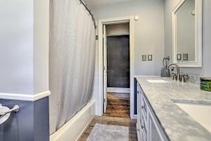 a bathroom with two sinks and a shower at Serene Hopatcong Cottage with 50-Foot Dock! in Hopatcong +20 photos