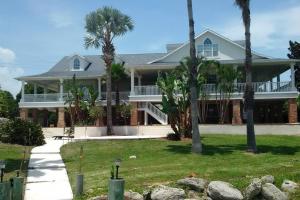 a house with palm trees in front of it at Villa Melbourne inter-coastal 2 floors 7br, heated pool in Melbourne