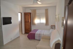 Cama o camas de una habitación en APARTAMENTO EN OLVERA CON GARAJE