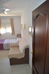 Cama o camas de una habitación en APARTAMENTO EN OLVERA CON GARAJE