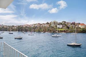 a group of boats in a large body of water at BADEN - Absolute Water Front Sydney Harbour Studio in Sydney