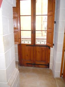 a room with a wooden door and windows at D-House in Birgu