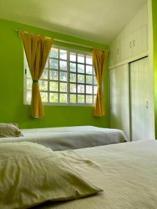 Giường trong phòng chung tại Casa hogareña con excelente ubicación en la ciudad