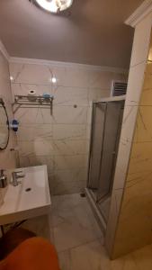 a bathroom with a shower and a sink at Galata Life Istanbul in Istanbul