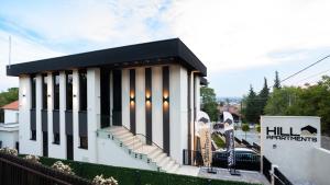 a building with black and white stripes on it at Hill Apartments in Požarevac