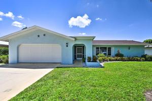a house with a garage in a yard at Naples Paradise with Private Pool, 4 Mi to Beach! in Naples