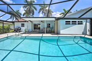 a swimming pool in the middle of a house at Naples Paradise with Private Pool, 4 Mi to Beach! in Naples