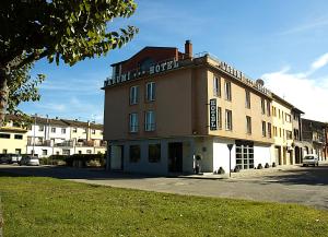 a building on the corner of a street at Hotel Arumí in Santa Eugenia de Berga