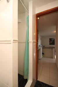 a hallway leading into a bathroom with a door open at Apartments with a parking space Rukavac, Vis - 2444 in Rukavac