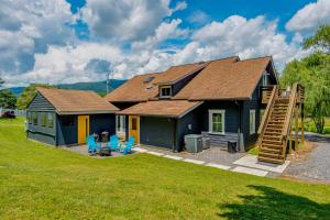 a blue house with a pitched roof at Old Lytle Cove Rd - Lower Unit in Swannanoa