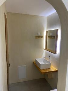 a bathroom with a sink and a mirror at VILLA NOULI in Sarakiniko
