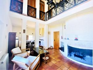 a living room with a large aquarium in the middle at Welcoming villa in Torres with private pool in Torres