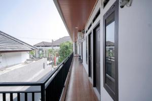 an empty balcony with a view of a building at RedDoorz @ Jalan Urip Sumoharjo Lampung in Kedaton +20 photos