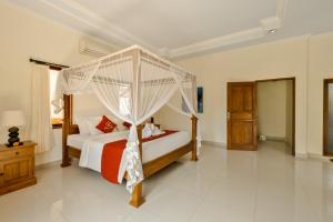 Postel nebo postele na pokoji v ubytování Gora House Bali