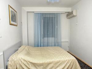 a hospital room with a bed and a window at Apartments by the sea Komiza, Vis - 2429 in Komiža
