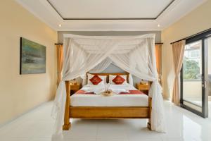 Postel nebo postele na pokoji v ubytování Gora House Bali
