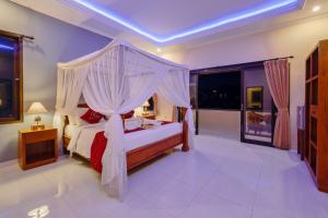 Postel nebo postele na pokoji v ubytování Gora House Bali