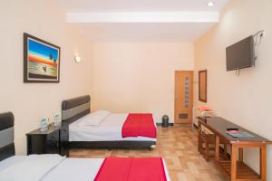 Voodi või voodid majutusasutuse RedDoorz @ Panglima Sudirman Madiun toas +37 fotot