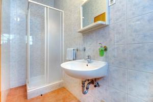 a bathroom with a sink and a shower at Apartments and rooms with parking space Nerezine, Losinj - 2506 in Nerezine