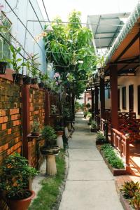 a corridor of a greenhouse with potted plants at Ngoc Qui Bungalow in Phu Quoc