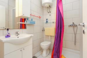 a bathroom with a toilet and a sink at Apartments by the sea Drasnice, Makarska - 2644 in Drasnice