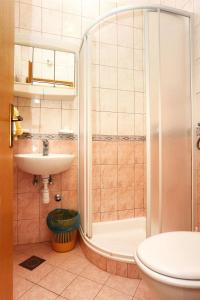 a bathroom with a shower and a sink at Studio Promajna 2605b in Promajna