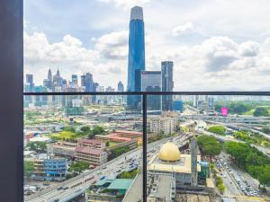 a view of the city from a skyscraper at Greystone Continew Residensi in Kuala Lumpur