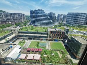 an aerial view of a city with tall buildings at July Apartment in Hangzhou