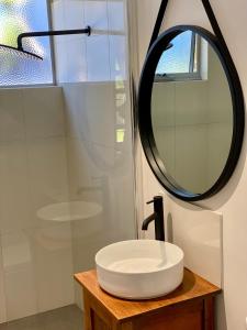 a bathroom with a sink and a mirror at EcoLuxe in Dunsborough