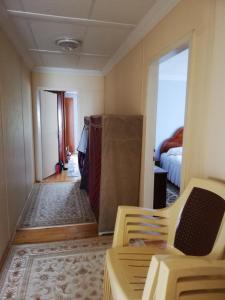 a room with a bed and a room with a hallway at Aydınlar yayla evi in Çarşıbaşı