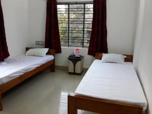 Tempat tidur dalam kamar di Lodge Lipika