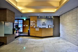 a lobby with a reception desk in a building at Seomyeon Hound Hotel 1st Street in Busan