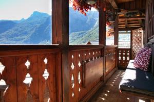 a wooden balcony with a view of a mountain at Weisses Lamm in Hallstatt