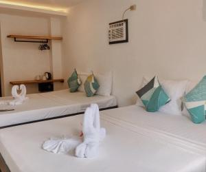 Postel nebo postele na pokoji v ubytování Palmera El Nido Inn