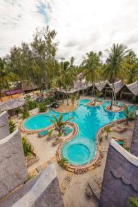 an overhead view of a pool at a resort at The Nest Boutique Resort in Paje