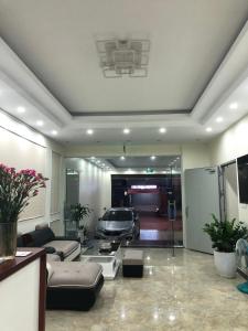 a living room with a car in a garage at Noi Bai Boutique Hotel in Hanoi