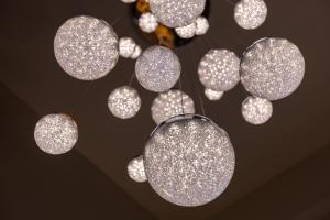 a bunch of silver lights hanging from a ceiling at Bastione Spasimo Boutique Hotel in Palermo