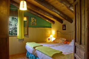 Postel nebo postele na pokoji v ubytování Finca la Colorá