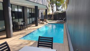 a swimming pool in the middle of a building at Zuri Residences at Ten Degrees in Johannesburg