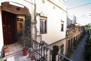 a balcony of a building with potted plants on it at Casa Tortilla Sagrada Familia in Barcelona