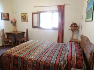 Ένα ή περισσότερα κρεβάτια σε δωμάτιο στο Tree House Hostel