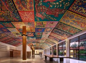 a building with a ceiling covered in colorful tiles at Cinnamon Bentota Beach in Bentota