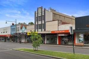 a city street with a tree in front of a building at 2 bedroom apartment in the heart of the city! in Bendigo